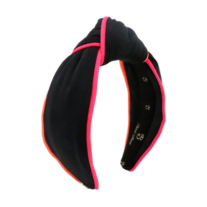 Black headband with pink and orange trim on a white background