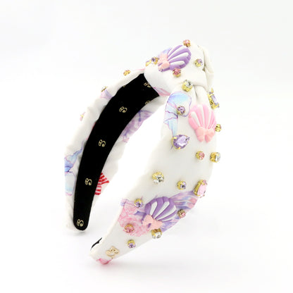The Seashell Bow Rhinestone Topknot